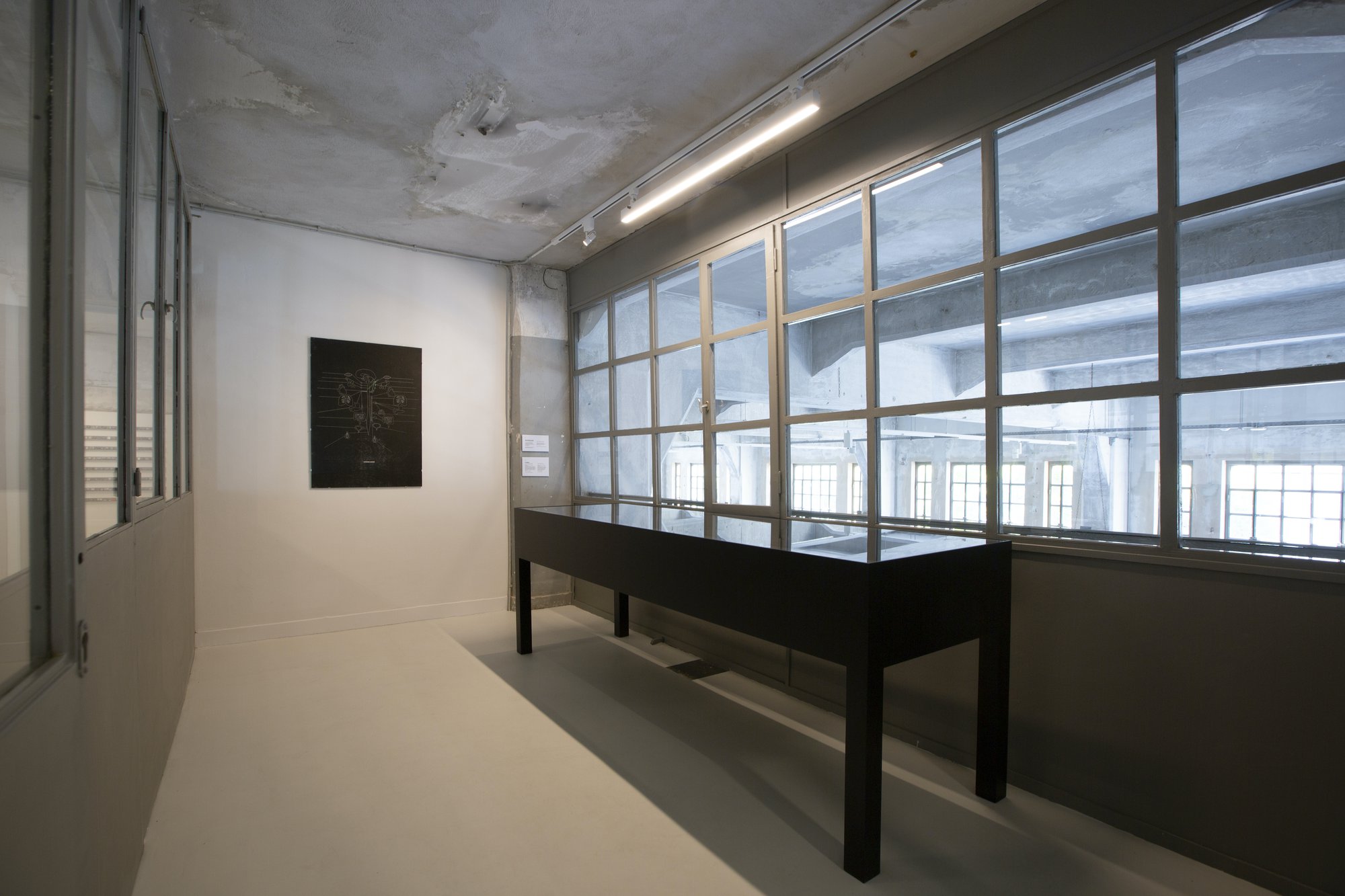 Sidsel Meineche Hansen, Automatic Worker, Laser woodcut on paper, mounted on aluminium under museum glass 101.3 × 70.7 cm, 2013/2016. Installation view, Portals, NEON, Former Tobacco Factory, 2021